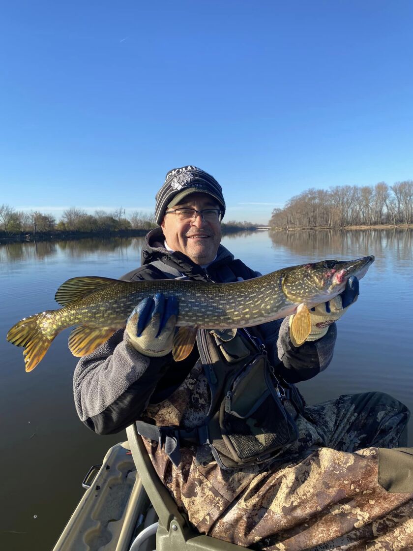 Larry Narro with a late-fall northern pike from the Des Plaines River. Provided photo