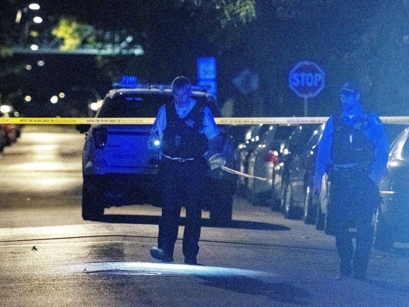 Police investigate the scene where a man was shot Friday morning near Independence and Fillmore. | Tyler LaRiviere/Sun-Times