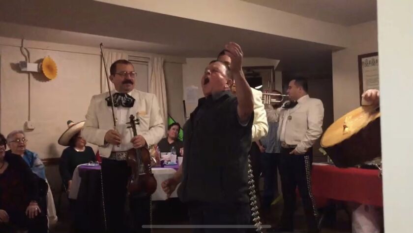 Raúl Montes singing at a family gathering.