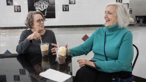 Genell Scheurell (left) and Melanie Tilman enjoy some ice cream at Burger Bite in Rogers Park. “It reminds me of where we used to eat when we were kids — diners and truck stops,” Tilman says. 