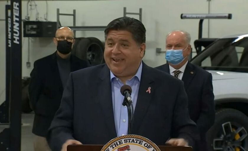 Gov. J.B. Pritzker answers questions at a news conference at Heartland Community College on Thursday. 