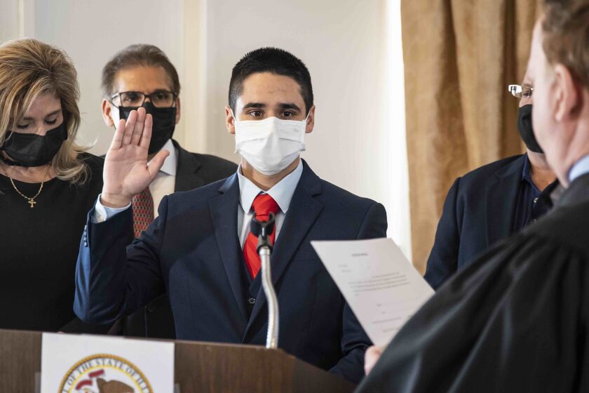 Edward Guerra Kodatt is sworn into office as state representative in the 22nd House District seat, a position held by former Illinois’ Speaker of the House Mike Madigan since 1971, Sunday, Feb. 21, 2021 in Chicago. (Ashlee Rezin Garcia/Chicago Sun-Times via AP) ORG XMIT: ILCHS218