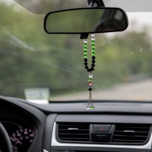 Prayer beads dangle from the rearview mirror of Felicia Salameh’s car on May 11, 2018 as she drives to the Prayer Center of Orland Park, IL. I Maria de la Guardia/Sun-Times