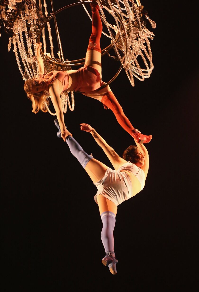 Acrobats perform on a chandelier during a dress rehearsal for Cirque du Soleil’s “Corteo” in this 2012 file photo.