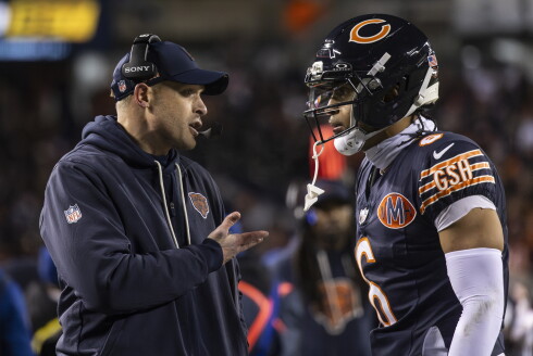 Bears head coach Ben Johnson speaks with defensive back Kyler Gordon during the fourth quarter against the Green Bay Packers in an NFC wild-card game at Soldier Field on Saturday, Jan. 10, 2026.