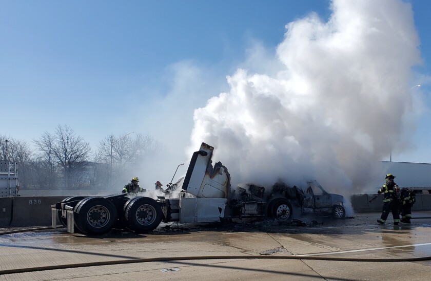 Two vehicles erupted in flames Thursday after a crash on the Regan Tollway near Naperville Road.