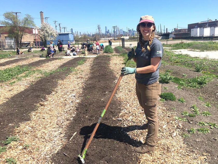 Jessica Surma, urban agriculture coordinator for Heartland Alliance, prepares the Chicago FarmWorks field for planting Sunday. | Mitch Dudek/Sun-Times