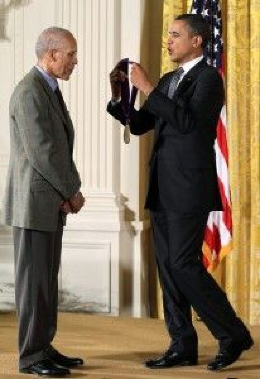 Martin Puryear accepts the National Arts and Humanities Medal from President Barack Obama in 2012. | Alex Wong/Getty Images
