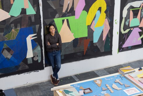 Muralist Caroline Kent poses for a portrait at her studio in Humboldt Park.