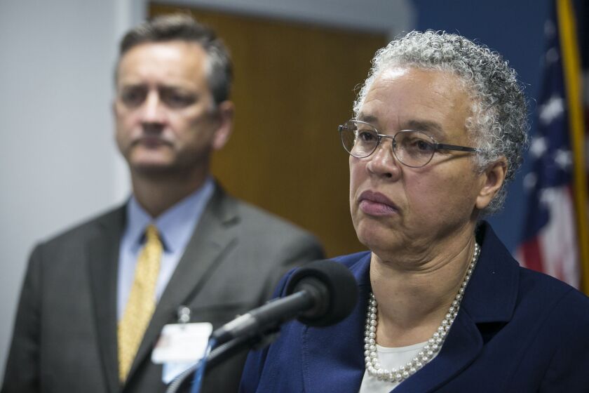 Dr. John Jay Shannon and Cook County Board President Toni Preckwinkle.