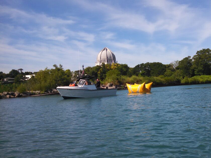 The weight for the Wilmette buoy being towed out for placement in 2015. Credit: Dale Bowman