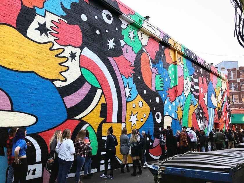 Mark McKenzie’s “Alley of Dreams” covers the exterior brick wall at Lincoln Hall, 2424 N. Lincoln Ave.