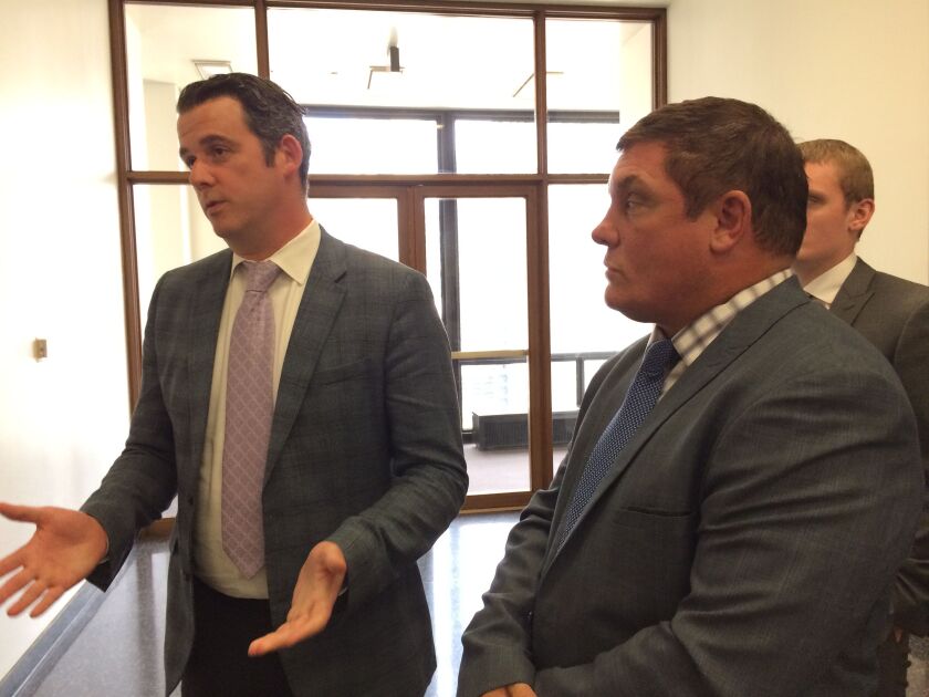 Attorney William Dorsey (left) and Double Door landlord Brian Strauss talk to reporters outside the courtroom on Thursday. | Andy Grimm/Sun-Times