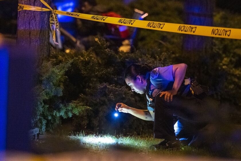 Chicago police investigate in the 300 block of West Elm Street where a 39-year-old man was shot in the leg in Seward Park, Monday, Sept. 19.