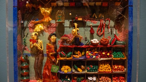 A nicho depicting an open-air market by Raúl López Reyes is part of a Day of the Dead exhibition at the National Museum of Mexican Art.