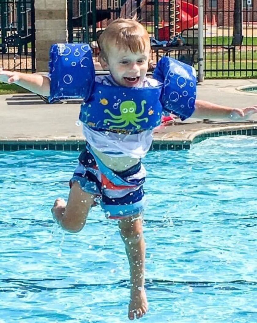 Judah Brown leaps into the water wearing a flotation vest. His mother Christi Brown says the device gave him a false sense of confidence and taught poor body positioning, which she believes put him at greater risk. He was 3 when he drowned, having gone in the water not wearing it.