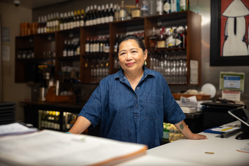 Saigon Sisters owner Mary Nguyen Aregoni stands behind the counter of her West Loop restaurant.