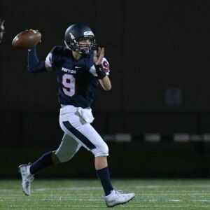 Payton quarterback Sage Shindler (9) rolls out to pass. | Worsom Robinson/For the Sun-Times.