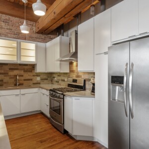 Galley kitchen with stainless steel appliances