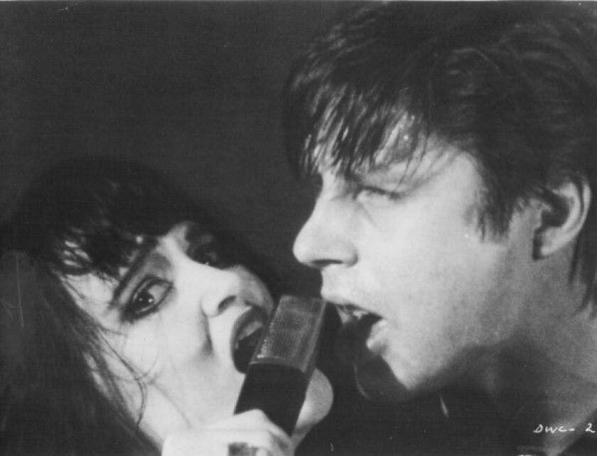 JOHN DOE AND EXENE – “X” in a scene from “The Decline of Western Civilization” by director Penelope Spheeris. | 3-WAY PRODUCTIONS/NU-IMAGE FILM