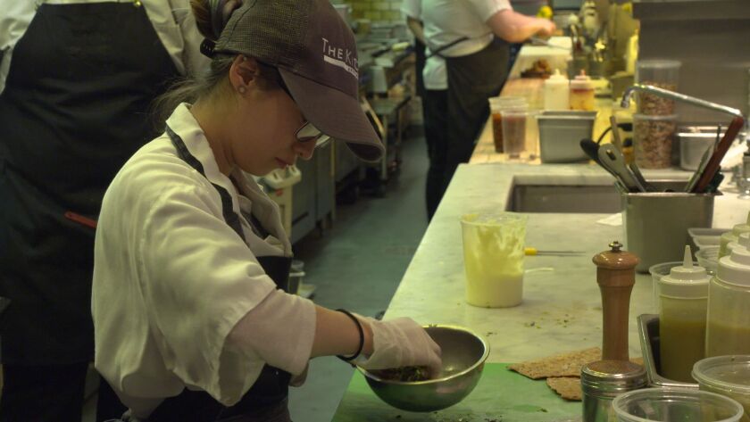 An assistant chef prepares dishes at The Kitchen Chicago, Kimbal Musk’s three-year-old, fine dining River North bistro, which donates 1 percent of all proceeds to his nonprofit Big Green’s “learning gardens” at Chicago Public Schools. | Jamie Leventhal/Fo