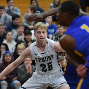 Lemont’s Lukas Rekasius (25) waits in the paint for a rebound. Worsom Robinson/For the Sun-Times.
