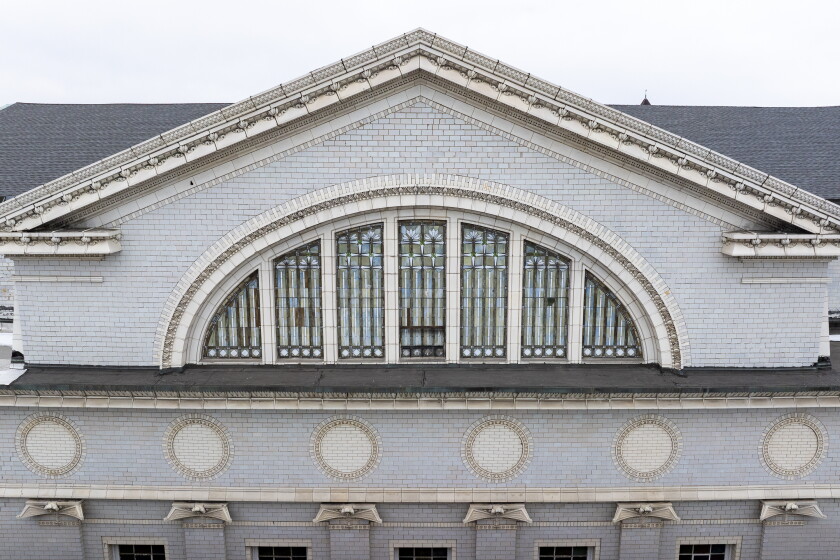 Stained glass and architectural details on the east face of the Metropolitan Missionary Baptist Church.