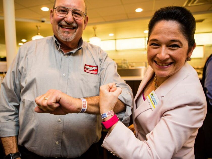 State Comptroller Susana Mendoza, right, with Ken Raskin, left, owner of Manny’s Deli on Election day, March 20th, 2018.