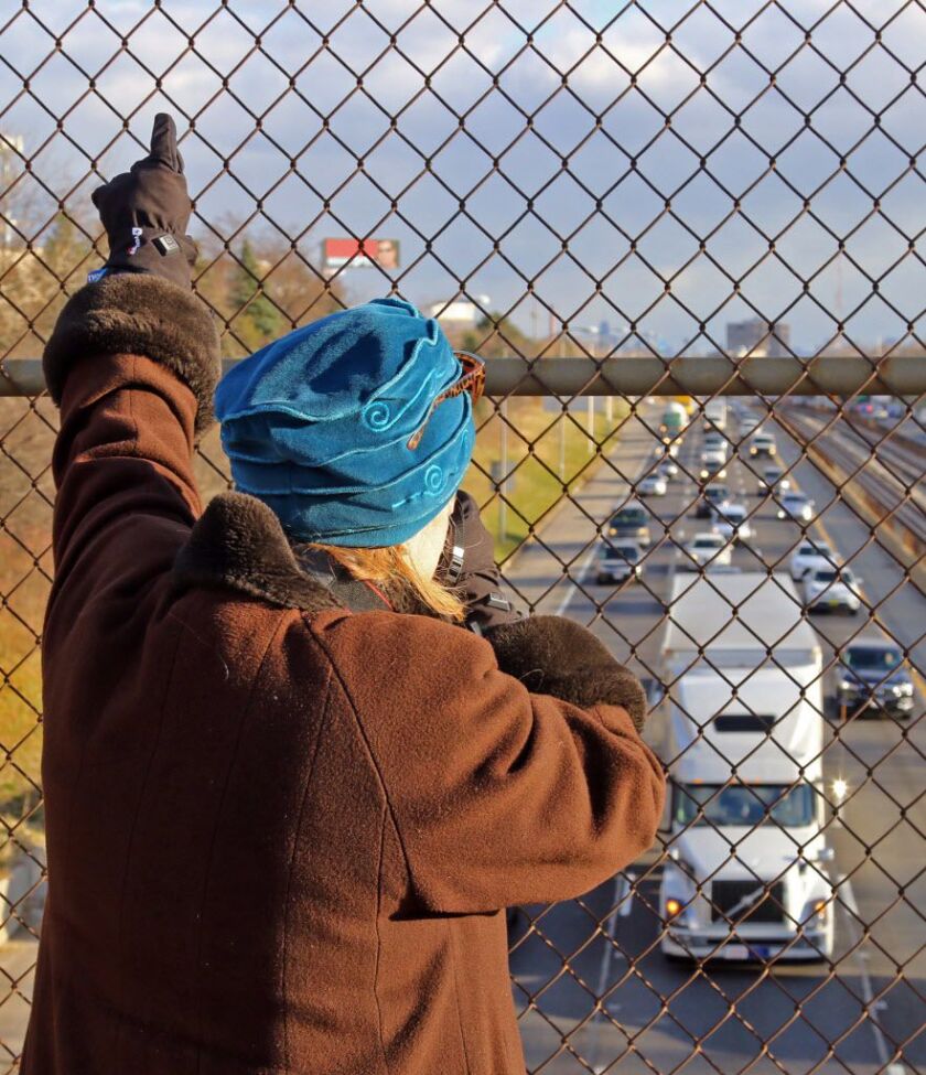 Veronica Wolski waves to drivers during her protests on a Kennedy expressway overpass, and she says she has a soft spot for law enforcement, crossing herself whenever a police car drives by. | Tim Boyle/For the Sun-Times