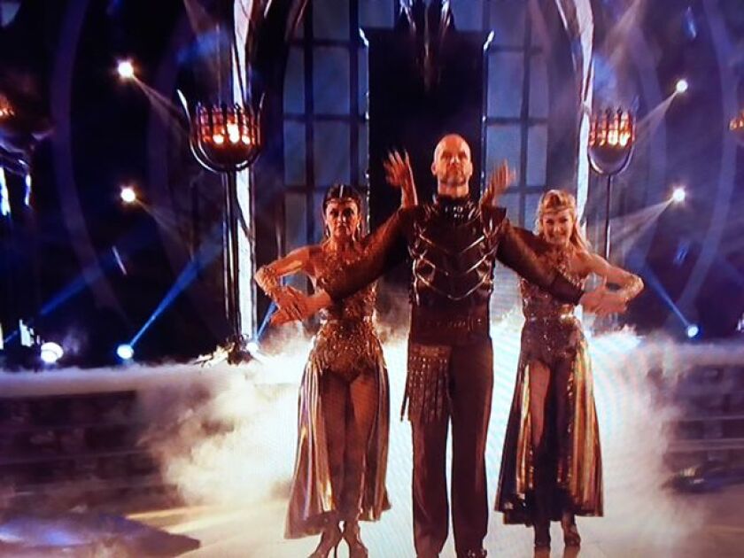 David Ross and his partners Hayley Erbert (left) and Lindsay Arnold dance a trio paso doble Monday night on “Dancing With the Stars.” | VIDEO IMAGE