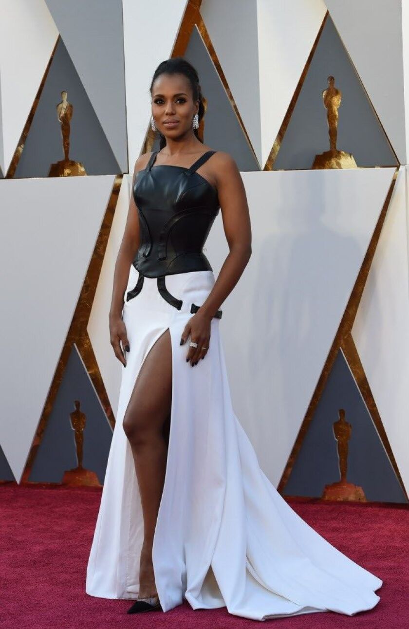 Actress Kerry Washington arrives in a black-and-white leather gown by Versace. | AFP PHOTO / VALERIE MACONVALERIE MACON/AFP/Getty Images