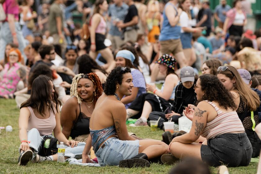 Festival-goers enjoy the second day of Pitchfork Music Festival at Union Park in the West Town neighborhood on Saturday afternoon.