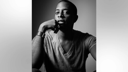 Black-and-white portrait of Los Angeles-based artist Sanford Biggers