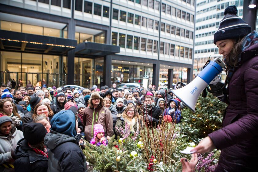 Kaitlin Fine, the associate company manager of the Chicago production of “Hamilton,” announces the winners of a day-of-show live lottery for 30 reduced-price matinee tickets, outside The Private-Bank Theatre in 2016.