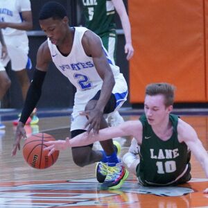 Lane’s Jimmy Mulvaney (10) tries to steal the ball away from Proviso East’s James Hobson (2), Wednesday 02-27-19. Worsom Robinson/For Sun-Times