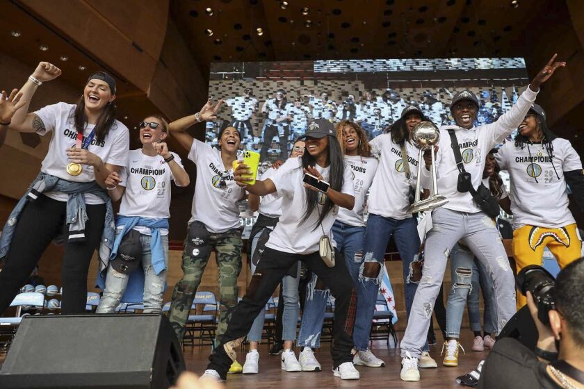 Sky players celebrate on stage at the Pritzker Pavilion in Millennium Park.