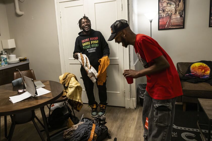 Hannibal Buress and drummer Jesse Williams, aka Drum Smoke, laugh as they chat about which outfit Buress should wear for his headlining stand-up comedy and music as Eshu Tune performance at The Chicago Theatre in the Loop, Thursday, Nov. 2.