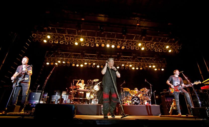Joe Don Rooney (from left), Gary LeVox and Jay DeMarcus of Rascal Flatts perform on March 10, 2016 in Palm Harbor, Florida. (Photo by Mike Lawrie/Getty Images)
