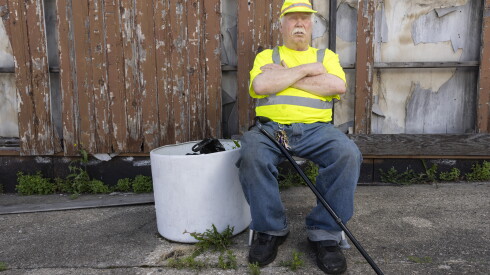 John Romando, a former West Suburban patient, poses for a portrait at his towing business in West Garfield Park on July 1, 2026. Romando is dialysis patient who had to get his care abruptly moved.