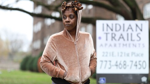 Jasmine Duckett, a resident of Indian Trails Apartments, stands in front of the development in West Pullman on Chicago's South Side.