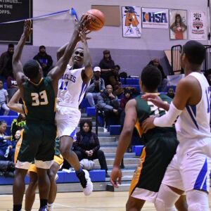 Brooks’ Kenneth Ross (11) gets fouled going to the basket against Ag. Science, Thursday 01-10-19. Worsom Robinson/For the Sun-Times.
