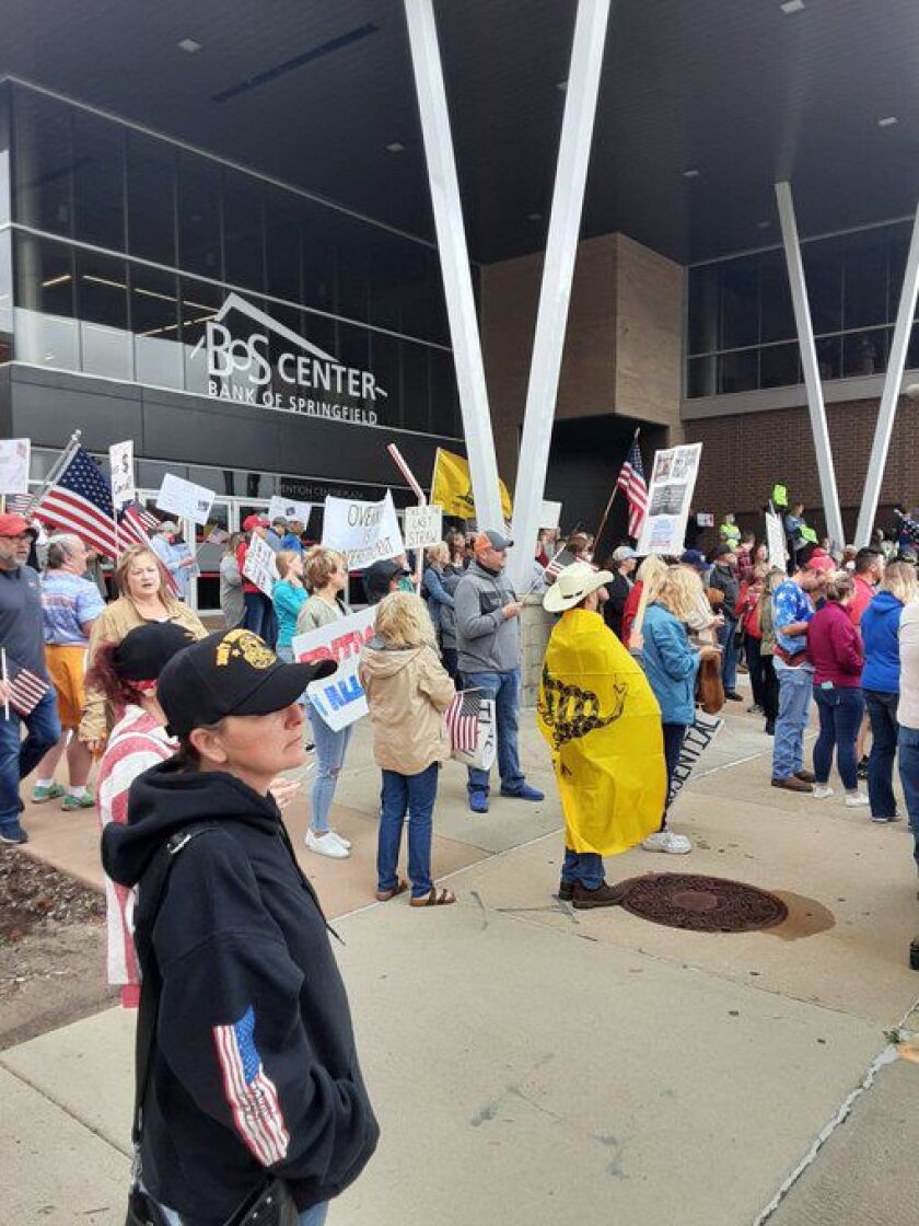 Protesters demonstrate outside the Bank of Springfield Center on Wednesday.