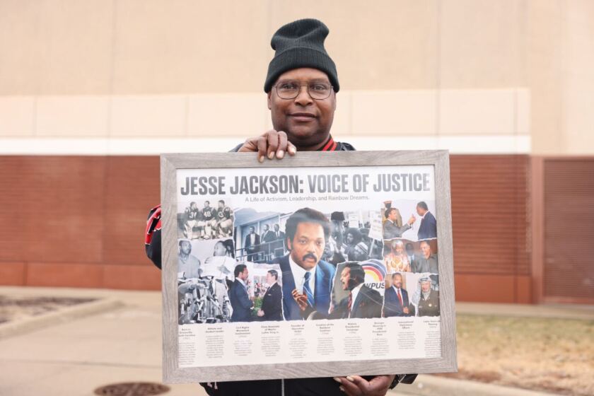 James Hickman holding a poster