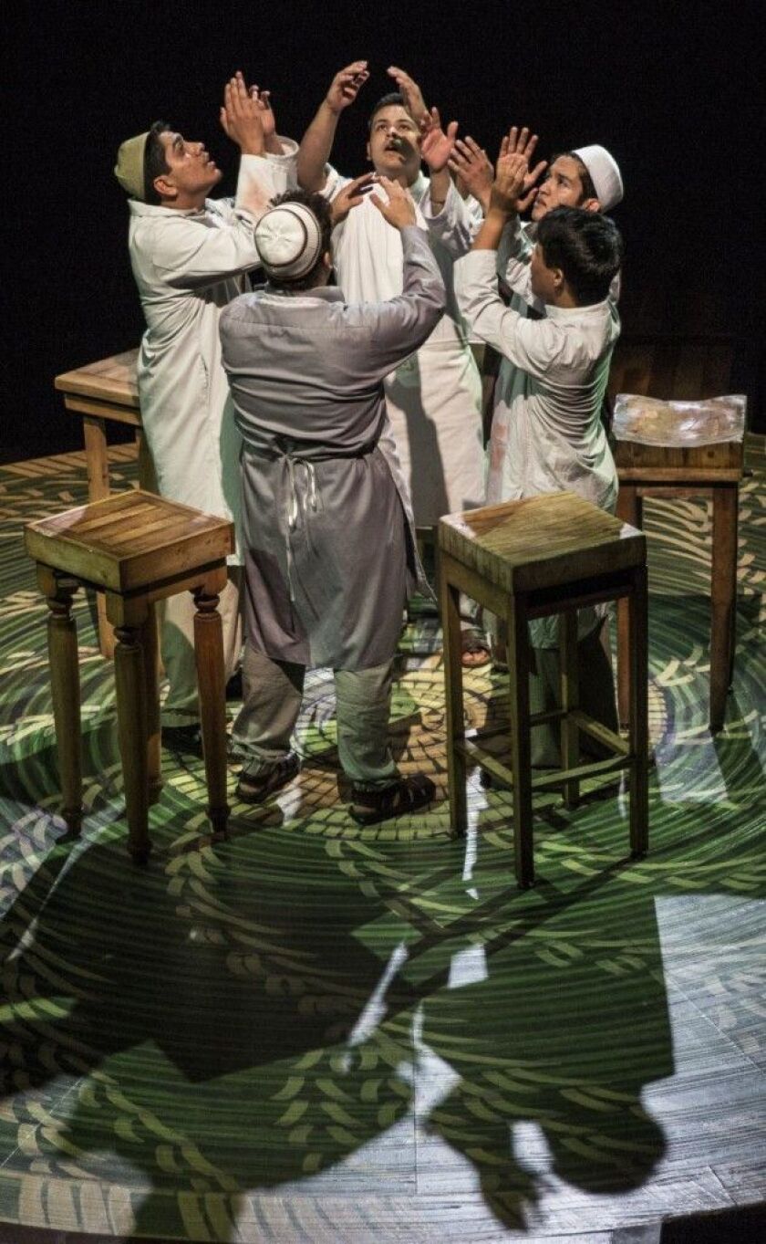 The butchers rejoice in the Albany Park Theater Project’s production of “Feast,” at the Goodman Theatre. (Photo: Liz Lauren)
