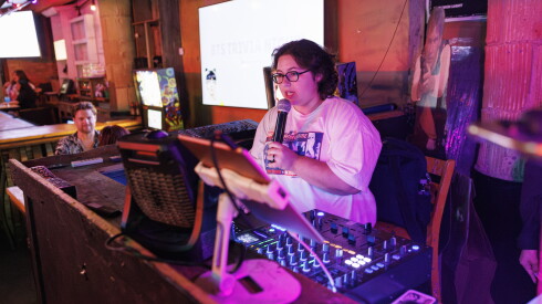Mollie Menuck, 25, manager at KPOP Merch by Choc Choc, hosts trivia night at Replay in Lake View on Tuesday.