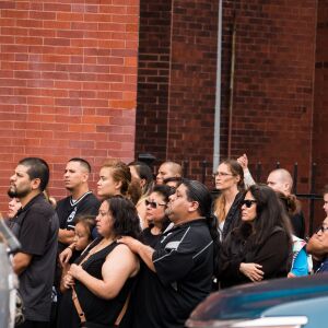 Family and friends watch as the caskets with victims from the Little Village fire are carried out of Our Lady Of Tepeyac church on September 1, 2018. | Max Herman/For the Sun-Times