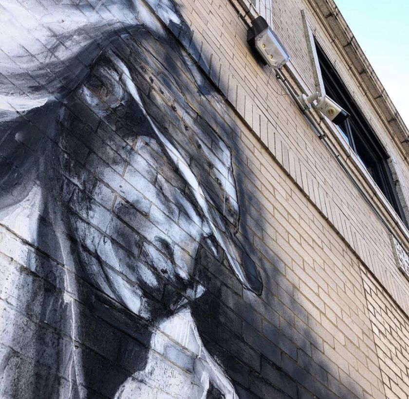 Juan De La Mora says he used charcoal on this mural from ovens in Mexico where agave was smoked to make mezcal.