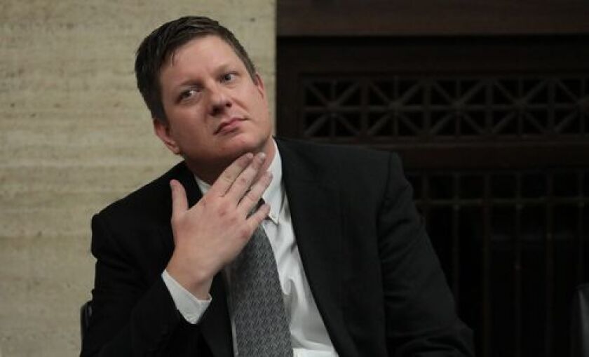 Amid jury deliberations Chicago police Officer Jason Van Dyke listens while attorneys step before Judge Vincent Gaughan bench, as the jury has sent another question to Judge Gaughan, who read it aloud from the bench, at the Leighton Criminal Court Buildin