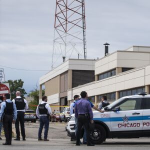 Chicago Police investigate at the 25th District station, 5555 W. Grand Ave., on the Northwest Side, after multiple officers were shot outside the station, Thursday morning, July 30, 2020. The suspect was also shot multiple times in the incident.