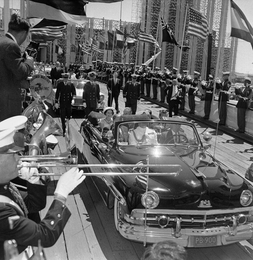 Pomp and circumstance and a flourish by the Marine CorpsBand greet Queen Elizabeth II, on July 6, 1959, at the entrance to Chicago’s International Trade Fair. This was one of sites the Queen and her husband Prince Philip visited during all-day tour of city.